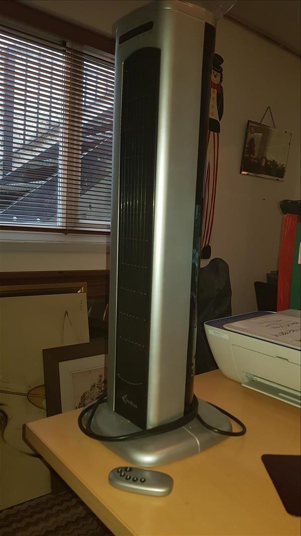Silver and black Delta tower fan with remote control 
